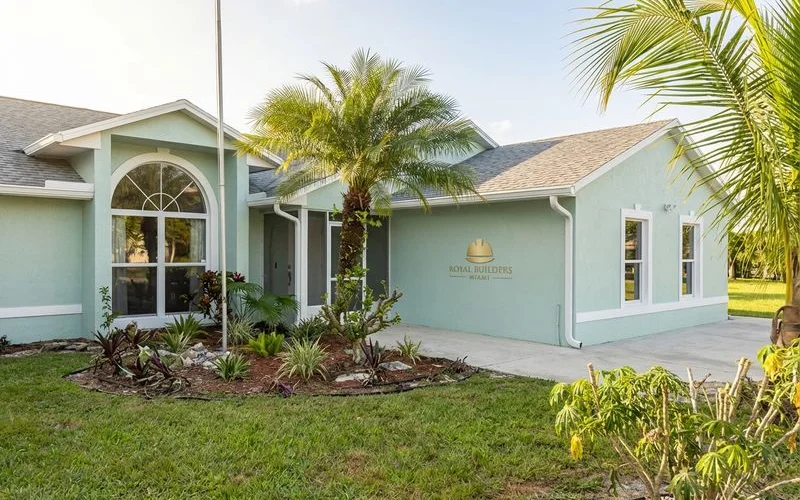 Freshly painted exterior of a Miami home in light coastal colors with crisp white trim details